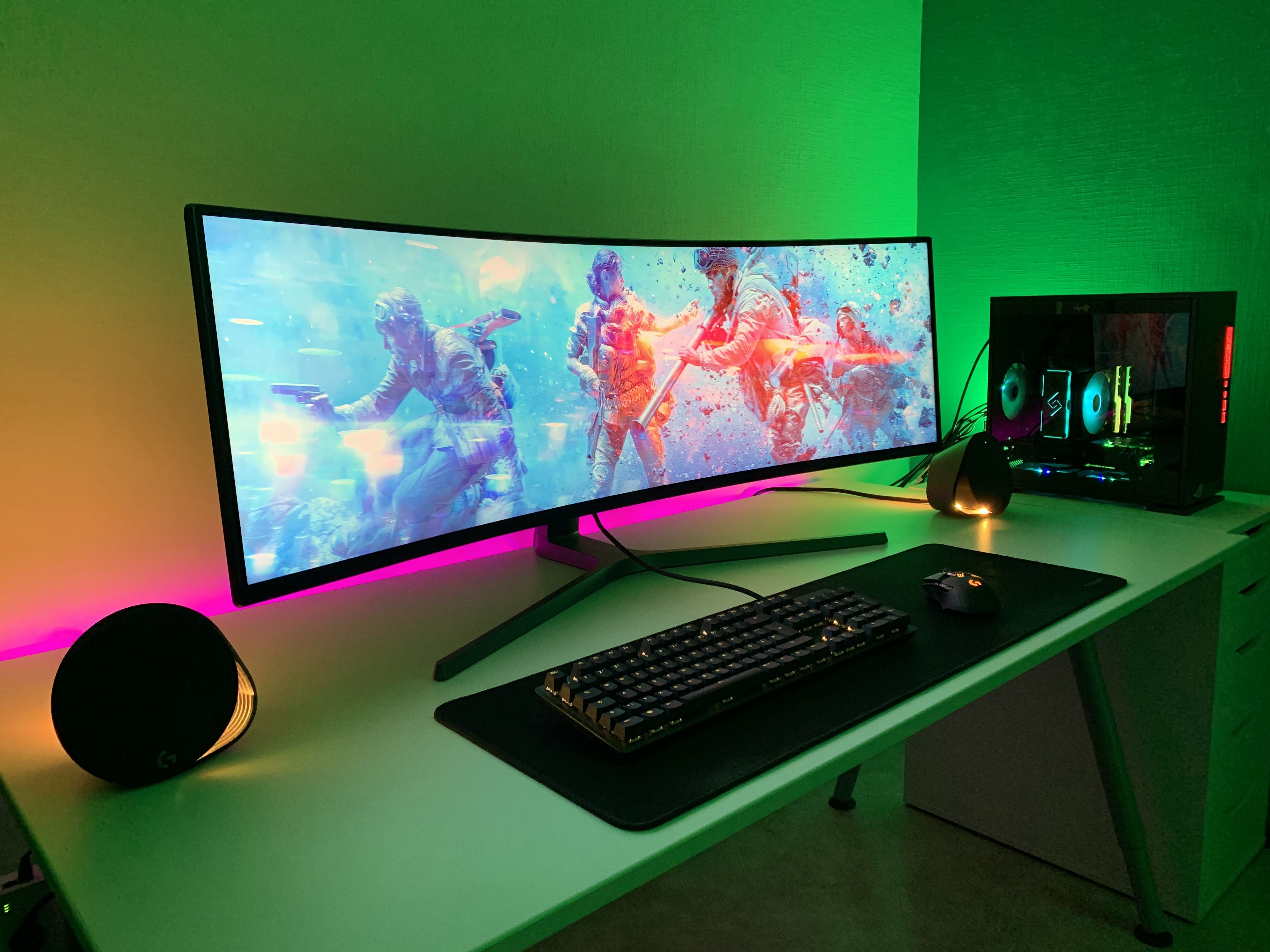 A high-performance gaming station with dual displays displaying advanced statistics